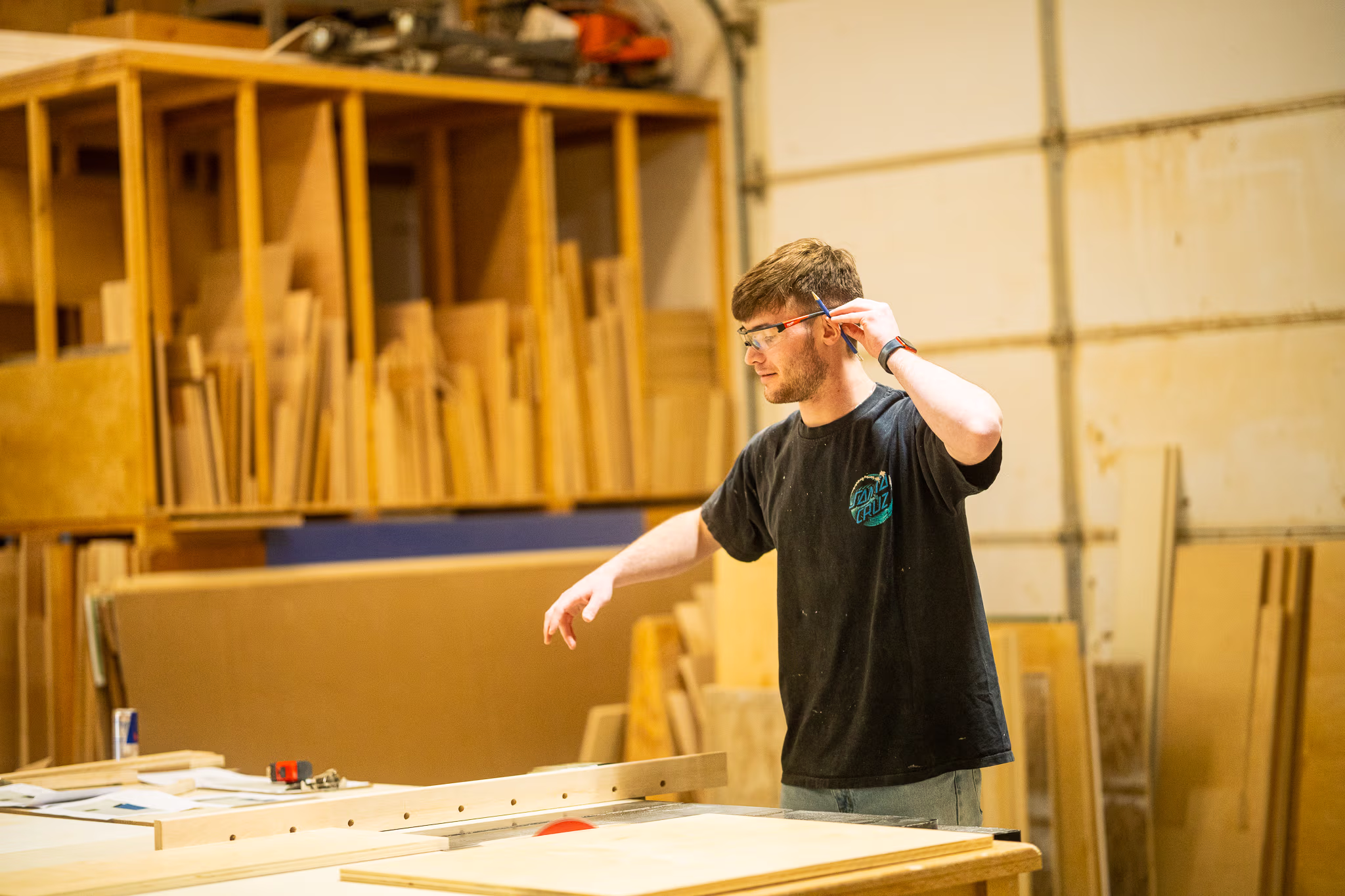 man making cuts at a table saw